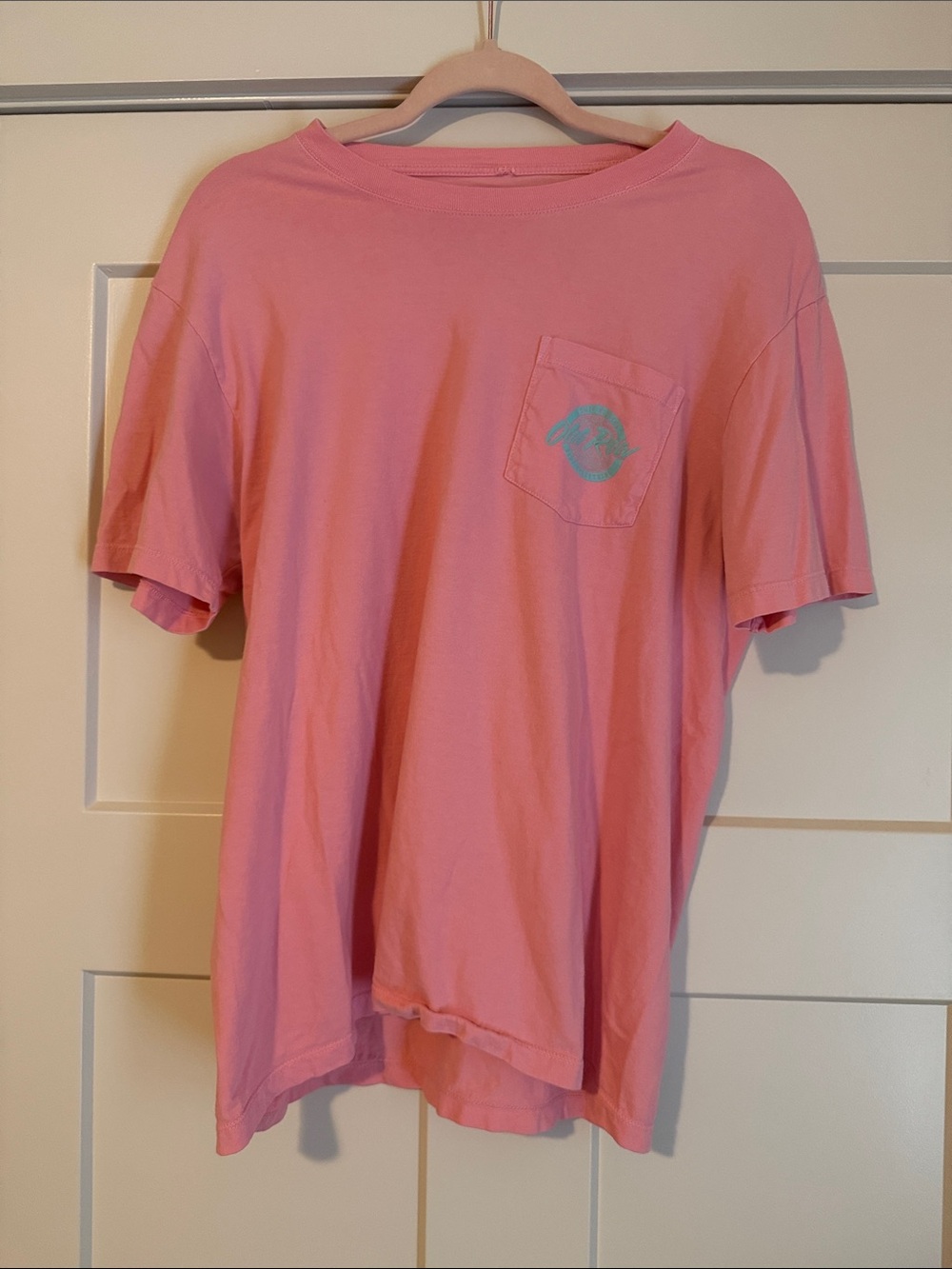 Relaxed Pink Short-Sleeve Pocket Tee with Subtle Chest Emblem